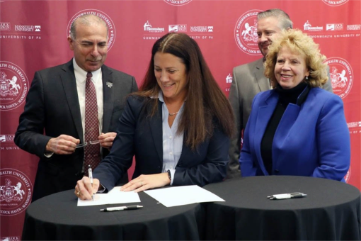  Image of Superintendent Kupsky signing agreement. 